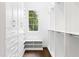 Spacious walk-in closet with ample shelving and drawers at 1107 E Beechwood Nw Dr, Atlanta, GA 30327