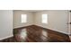 Bedroom with hardwood floors and natural light from two windows at 2656 County Line Sw Rd, Atlanta, GA 30331