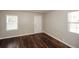 Bright bedroom with hardwood floors and two windows at 2656 County Line Sw Rd, Atlanta, GA 30331