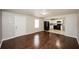 Open concept living room with hardwood floors and kitchen view at 2656 County Line Sw Rd, Atlanta, GA 30331