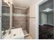 Updated bathroom with gray tile shower and modern vanity at 2656 County Line Sw Rd, Atlanta, GA 30331