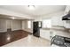 Modern kitchen with white cabinets, granite counters, and black appliances at 2656 County Line Sw Rd, Atlanta, GA 30331
