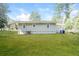 Side view of house showcasing a large backyard at 2656 County Line Sw Rd, Atlanta, GA 30331