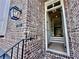 Inviting brick entryway with a charming lantern and an open door leading to the interior at 285 Briscoe Way # 2, Alpharetta, GA 30009