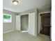 Bedroom with double doors leading to a spacious closet and additional access to other rooms at 4131 Tara Dr, Forest Park, GA 30297