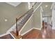 Elegant staircase with wrought iron railing and hardwood floors at 2227 W Village Se Ln, Smyrna, GA 30080