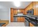 Modern kitchen with stainless steel appliances and granite countertops at 1468 Briarwood Rd # 805, Brookhaven, GA 30319