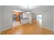 Open concept kitchen and dining area with hardwood floors and stainless steel appliances at 1468 Briarwood Rd # 805, Brookhaven, GA 30319
