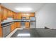 Modern kitchen with stainless steel appliances and granite countertops at 1468 Briarwood Rd # 805, Brookhaven, GA 30319