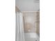 Bathroom with beige tile and a shower/tub combo at 1468 Briarwood Rd # 805, Brookhaven, GA 30319