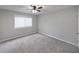 Spacious bedroom with neutral walls and carpet, ceiling fan, and window with blinds at 1468 Briarwood Rd # 805, Brookhaven, GA 30319