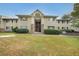 Tan two-story building with stone accents and landscaping at 1468 Briarwood Rd # 805, Brookhaven, GA 30319