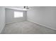 Bright bedroom featuring neutral walls, carpet, ceiling fan, and window with blinds at 1468 Briarwood Rd # 805, Brookhaven, GA 30319