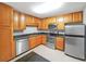 Modern kitchen with stainless steel appliances and granite countertops at 1468 Briarwood Rd # 805, Brookhaven, GA 30319