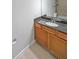 Bathroom with granite countertop, wood cabinets, and a large mirror at 1468 Briarwood Rd # 805, Brookhaven, GA 30319