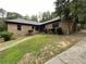 Brick house exterior with landscaped lawn and driveway at 1935 Lamp Post Ln, Lawrenceville, GA 30043