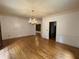 Formal dining room with hardwood floors and elegant chandelier at 1935 Lamp Post Ln, Lawrenceville, GA 30043