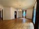 Spacious dining room featuring hardwood floors and a lovely chandelier at 1935 Lamp Post Ln, Lawrenceville, GA 30043