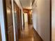 Long hallway with hardwood floors and wood doors at 1935 Lamp Post Ln, Lawrenceville, GA 30043