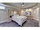 Basement bedroom with built-in dresser, mirror, and plush carpet at 8015 St Marlo Country Club Pkwy, Duluth, GA 30097