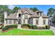 Elegant two-story home with manicured landscaping and a grand entrance at 8015 St Marlo Country Club Pkwy, Duluth, GA 30097