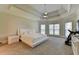 Large main bedroom with windows, ceiling fan, and ensuite bathroom at 8015 St Marlo Country Club Pkwy, Duluth, GA 30097