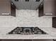 Stainless steel gas cooktop with marble backsplash at 45 Ivan Allen Jr Nw Blvd # 2306, Atlanta, GA 30308