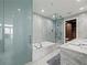 Elegant bathroom with marble finishes, soaking tub, and walk-in shower at 45 Ivan Allen Jr Nw Blvd # 2306, Atlanta, GA 30308