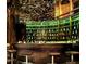 Curved bar with dark wood and stools, featuring a unique design at 45 Ivan Allen Jr Nw Blvd # 2306, Atlanta, GA 30308