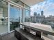 Private balcony with concrete table and chairs, offering city views at 45 Ivan Allen Jr Nw Blvd # 2306, Atlanta, GA 30308
