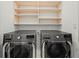Laundry room with LG washer and dryer and overhead shelving at 45 Ivan Allen Jr Nw Blvd # 2306, Atlanta, GA 30308