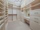 Bright walk-in closet with custom shelving and drawers at 45 Ivan Allen Jr Nw Blvd # 2306, Atlanta, GA 30308