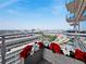 Enjoy city views from this balcony with potted plants at 45 Ivan Allen Jr Nw Blvd # 2306, Atlanta, GA 30308