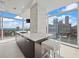 Modern kitchen island with marble countertop and city views at 45 Ivan Allen Jr Nw Blvd # 2306, Atlanta, GA 30308