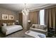 Luxurious bedroom with king-size bed and sitting area at 3630 Peachtree Rd # Ph3302, Atlanta, GA 30326