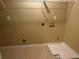 Laundry room with overhead shelving and space for a washer and dryer at 295 Rock House Rd, Lawrenceville, GA 30045