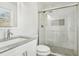 Modern bathroom with a large shower and gray vanity at 1988 Virginia Ave, Atlanta, GA 30337