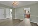 Dining room with chandelier and view of kitchen at 4140 Alveston Dr, Atlanta, GA 30349