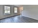 Living room with gray-toned wood-look flooring and neutral walls at 3390 Wake Robin Way, Cumming, GA 30040