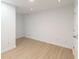 Empty bedroom with light wood-look flooring and white walls at 1268 Liberty Nw Pkwy, Atlanta, GA 30318