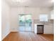 Bright dining area with hardwood floors and sliding glass doors leading to a deck at 1268 Liberty Nw Pkwy, Atlanta, GA 30318