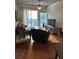 Living area with access to a private balcony, hardwood floors, and comfortable furniture at 44 Peachtree Ne Pl # 424, Atlanta, GA 30309