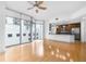 Open living room and kitchen with hardwood floors and stainless steel appliances at 222 12Th Ne St # 702, Atlanta, GA 30309