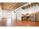 Open concept living area with hardwood floors and exposed beams at 1846 Liberty Ln, Roswell, GA 30075