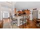 Kitchen with breakfast bar and view into the main living area at 2600 Wells Sw Ter, Atlanta, GA 30331