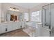 Elegant bathroom with double vanity, soaking tub, and separate shower at 2600 Wells Sw Ter, Atlanta, GA 30331
