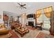 Open living room showcasing a fireplace and access to the outdoors at 2600 Wells Sw Ter, Atlanta, GA 30331