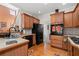 Eat-in kitchen with wood cabinets, tile countertops, and modern appliances at 2600 Wells Sw Ter, Atlanta, GA 30331