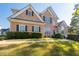 Brick two-story house with a gray roof and landscaping at 2600 Wells Sw Ter, Atlanta, GA 30331