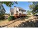 Two story house with deck, backyard and mature trees at 2600 Wells Sw Ter, Atlanta, GA 30331